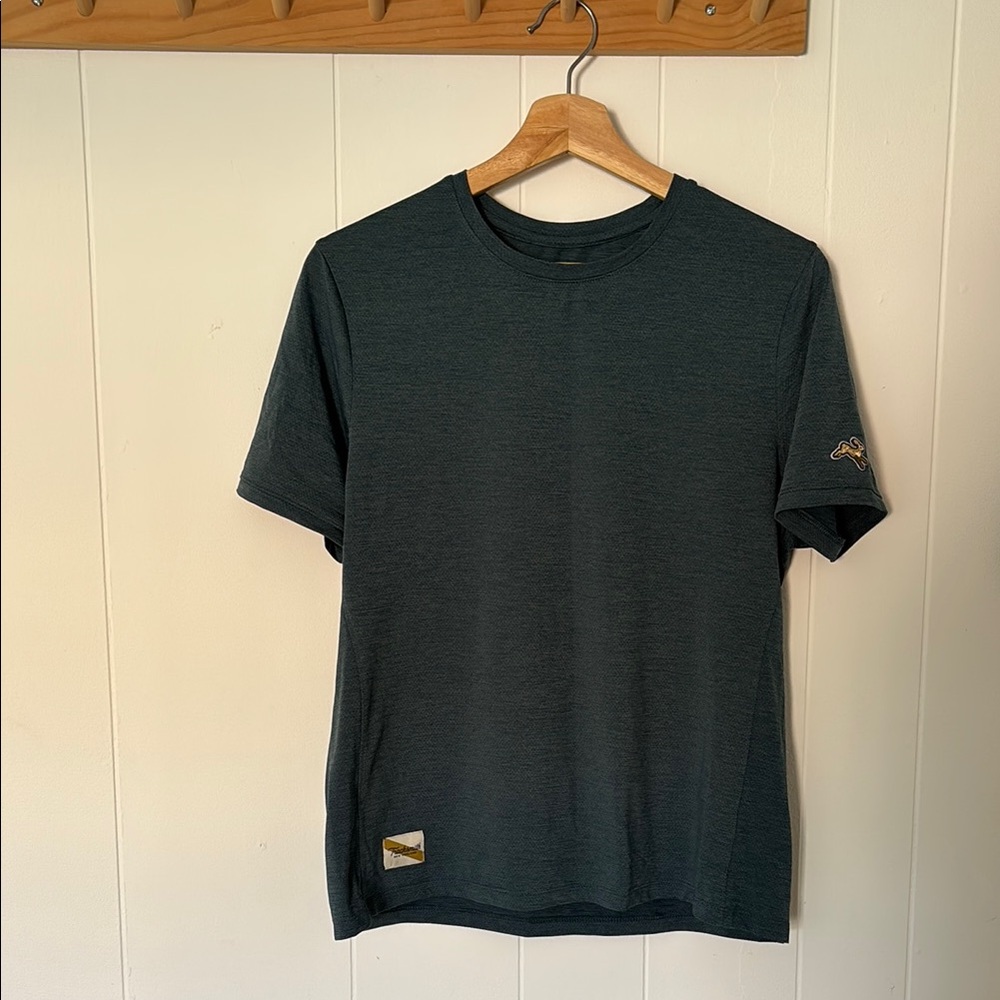 Tracksmith teal shirt